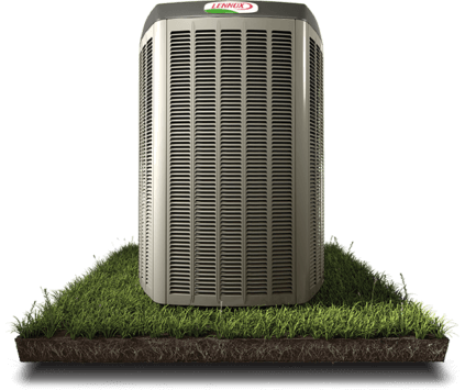 heat pump on grass A heat pump on a grassy lawn.